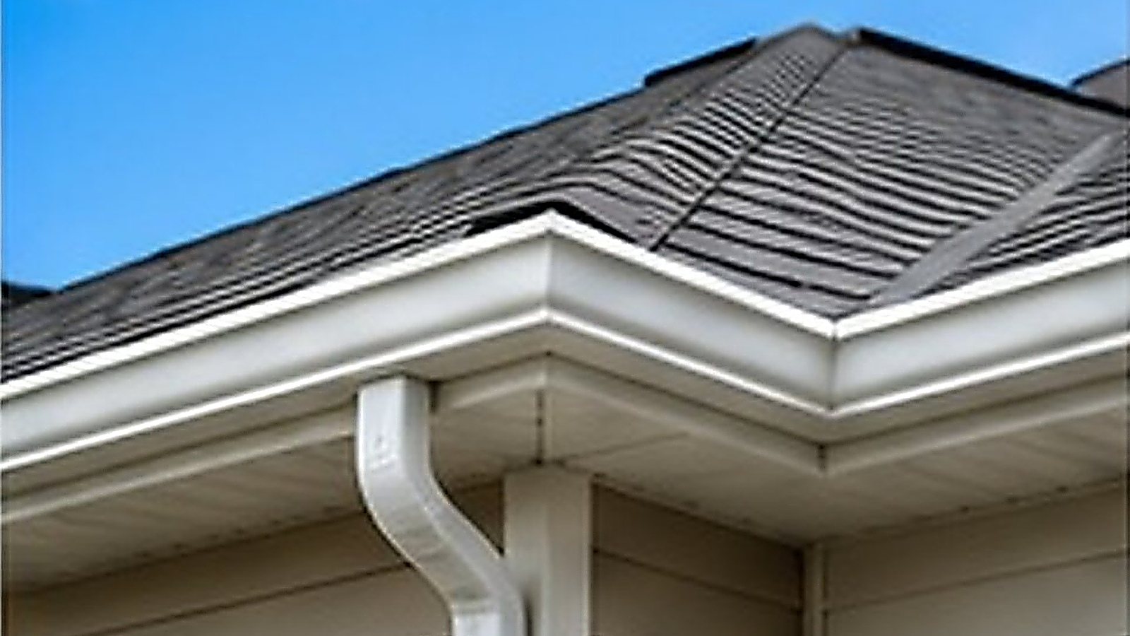 Clean roofline and gutters on a sunny day